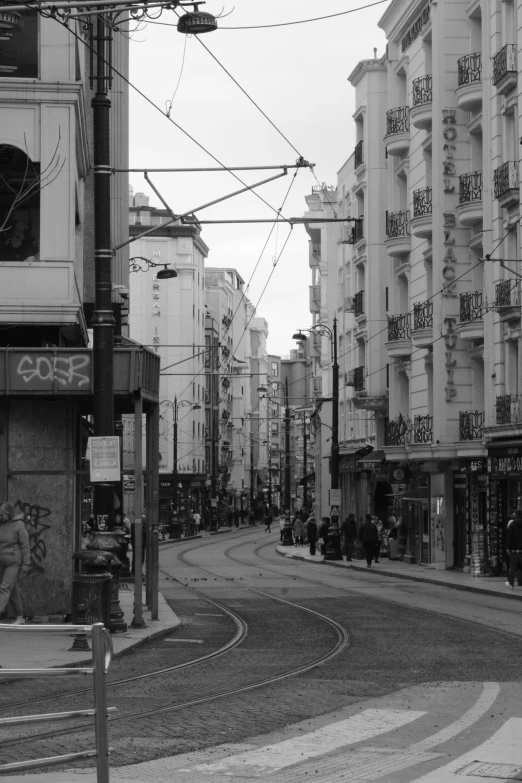 the picture shows the corner of a city street, including lots of buildings