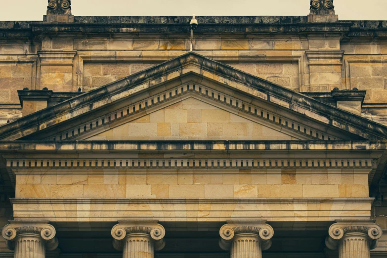 a couple of columns sitting in front of a building