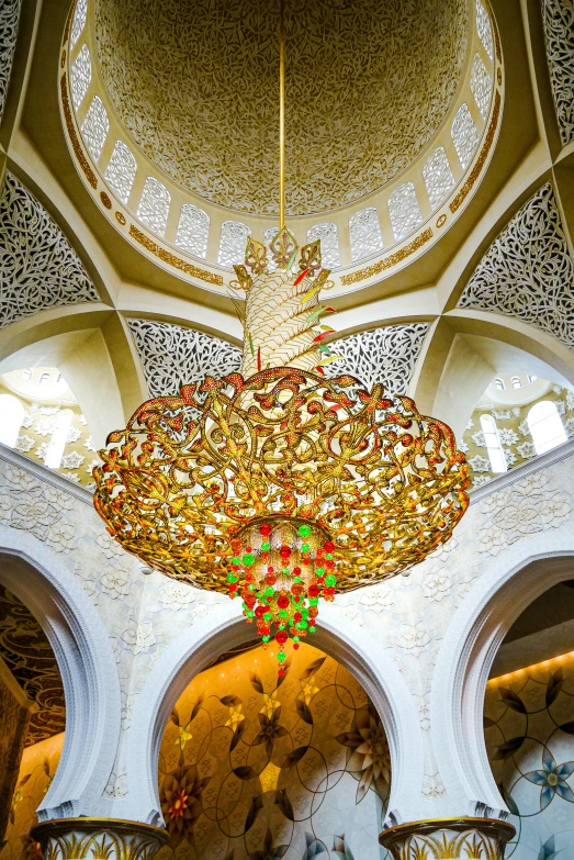 an ornate structure with gold ornaments and chandelier