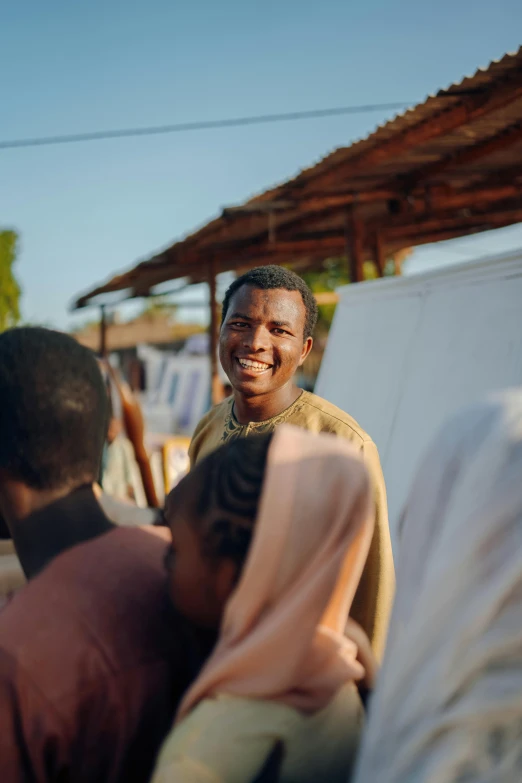 a young man with a small child is smiling