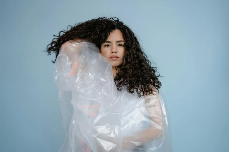 a young lady with wet hair wrapped up in plastic