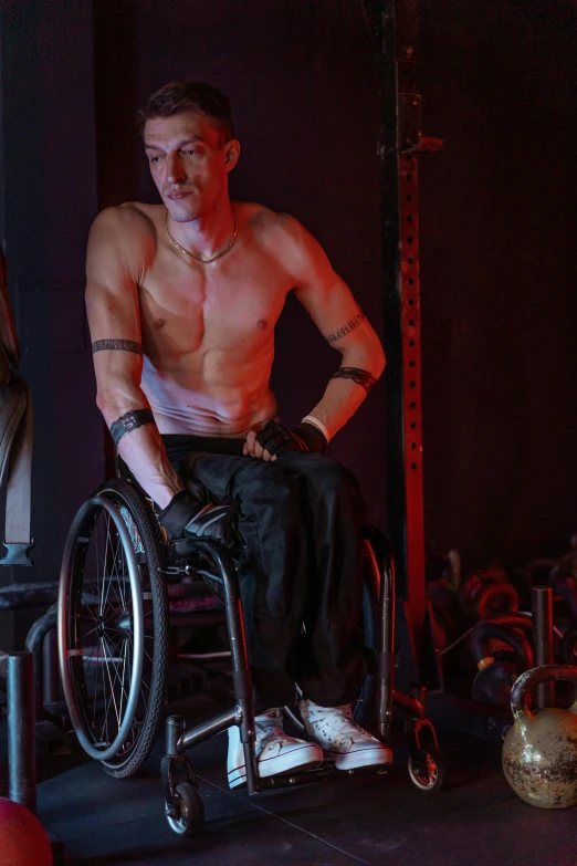 man with a large arm and  on in a wheel chair