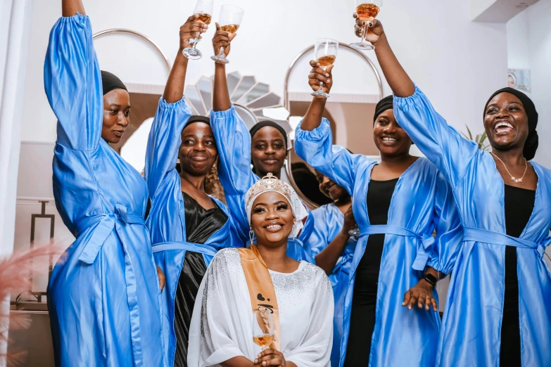 a group of women are standing with one another