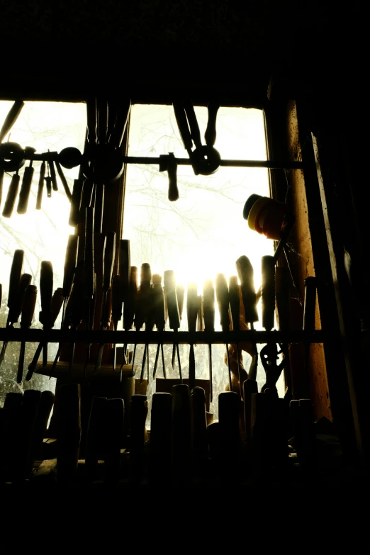 a window with hooks and pins and hooks hanging from it