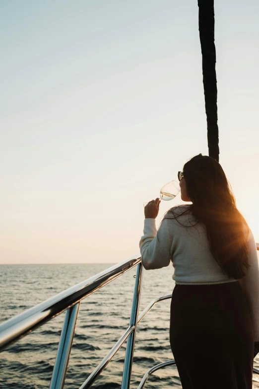 a woman on a boat is blowing bubbles