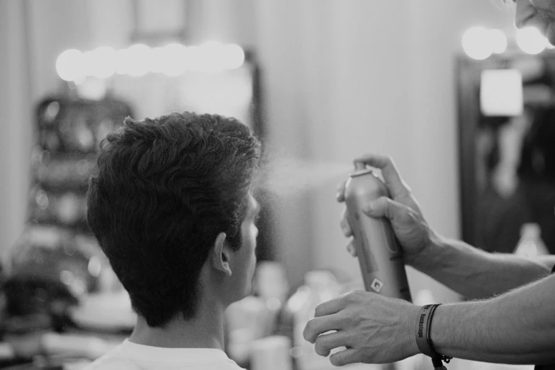 a person giving another person a haircut