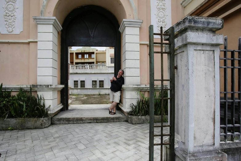 a woman is standing in the door way