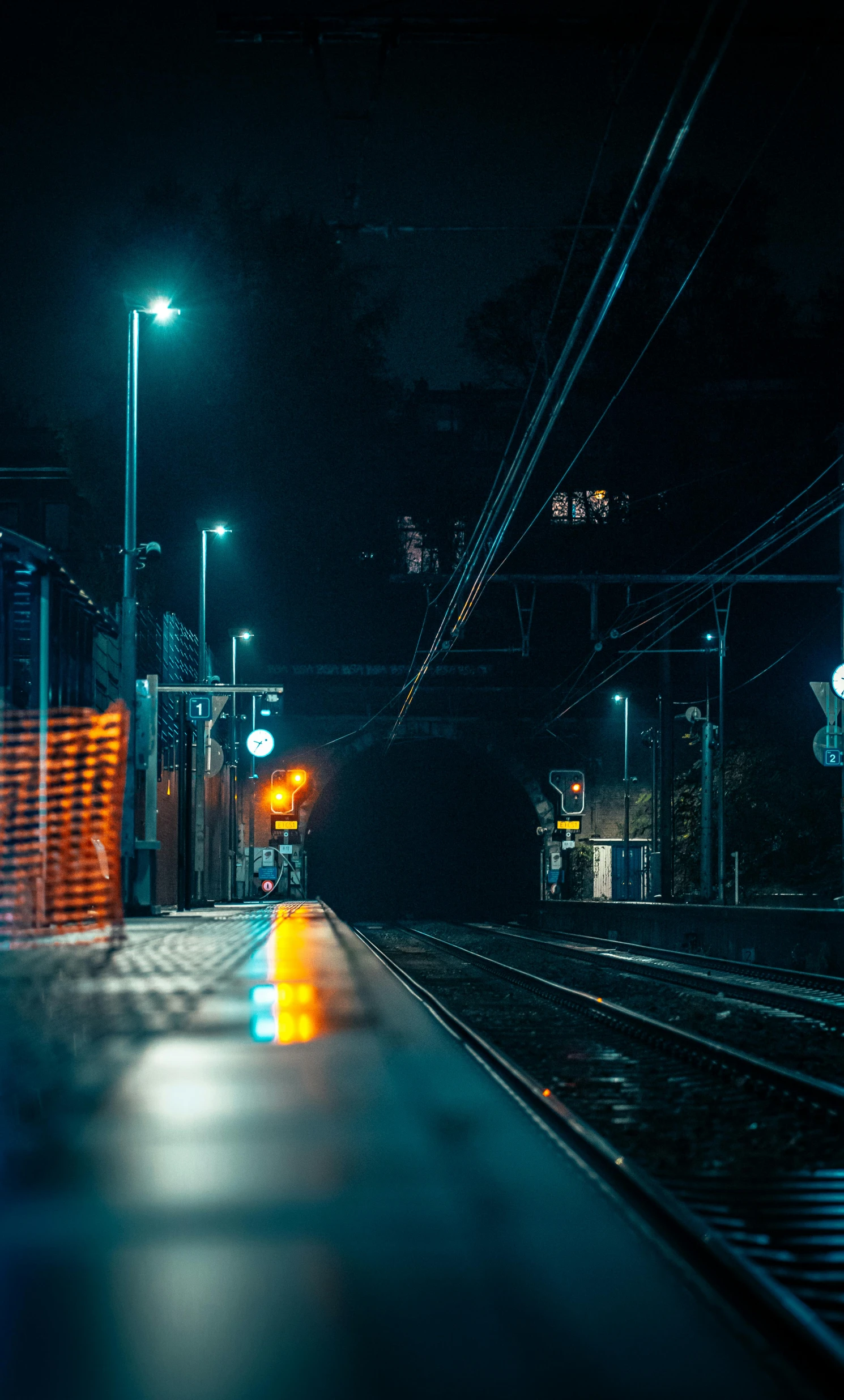 the lights shine on an empty train station at night