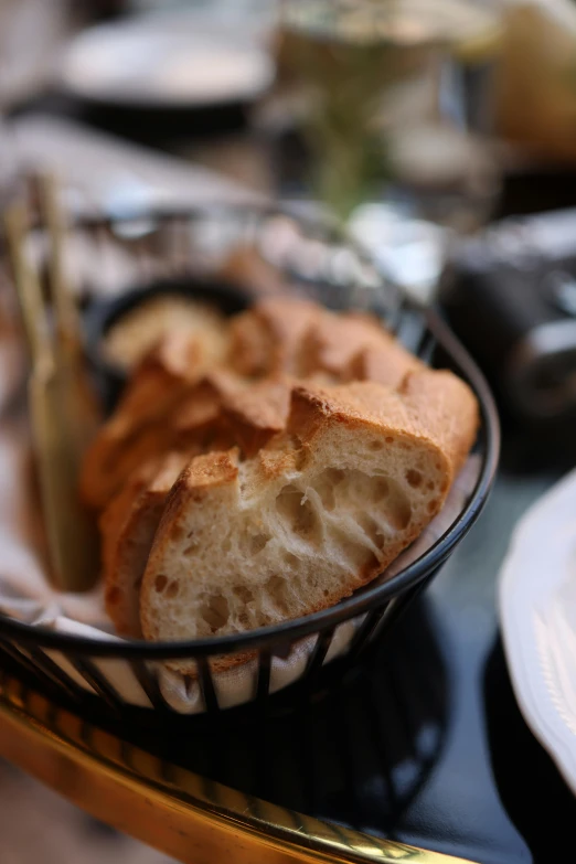 a bowl with bread on it and a fork laying in front of it