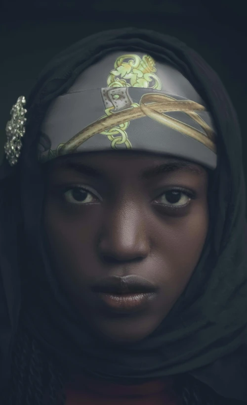 young black woman in head scarf with scarves