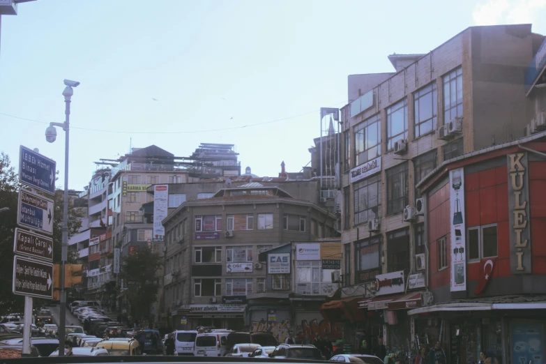 a city street lined with tall buildings and lots of traffic