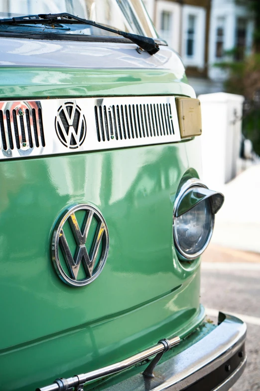 a green volkswagen emblem and a building