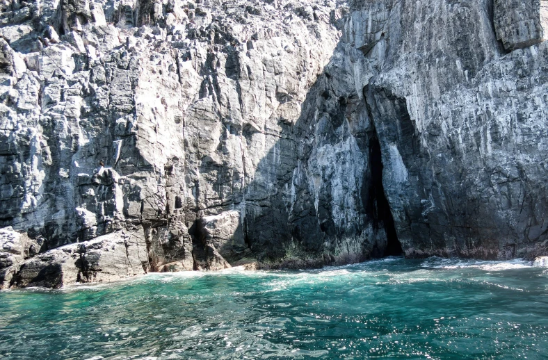 a sea and some water with two large rocks