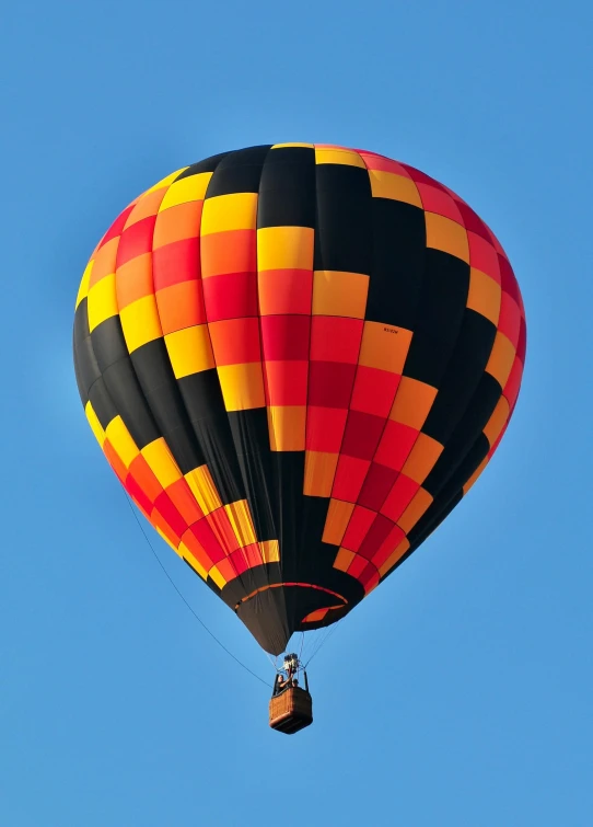 a colorful  air balloon floating through the sky