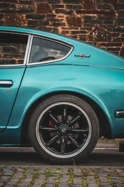 a blue car parked on a city street