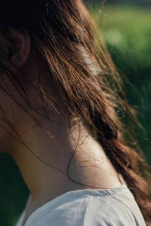 a woman is wearing a bird with her hair flowing around