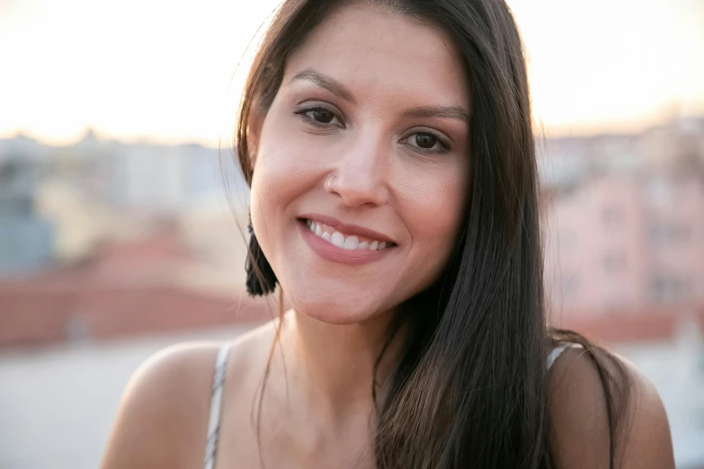 a women who is smiling with very long hair