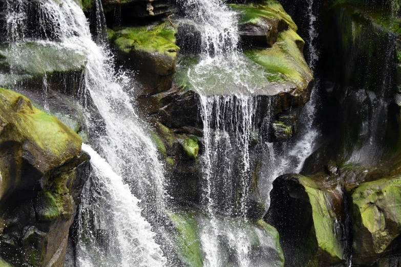 this is an image of a waterfall in the forest