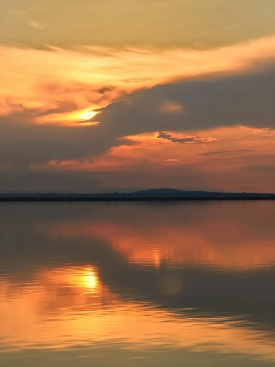 the sunset reflects on the water on the sea