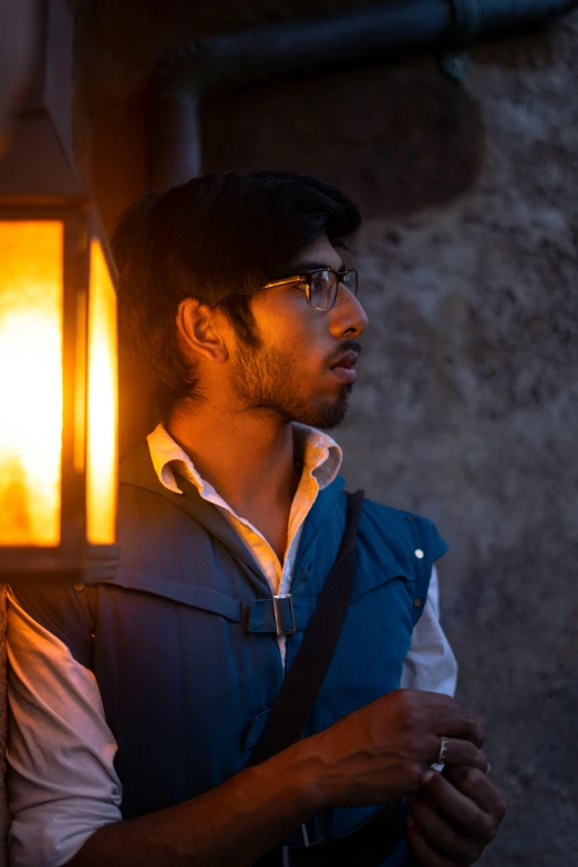 a man standing in front of an old light