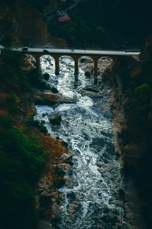 a bridge spanning over a stream over a river