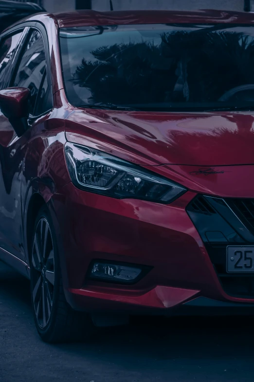 a red car parked in the city street