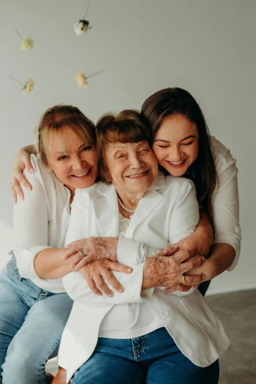 mother hugging two s in the living room