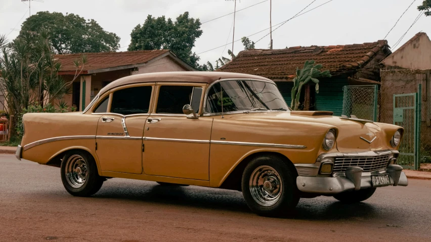 an old car in front of some buildings