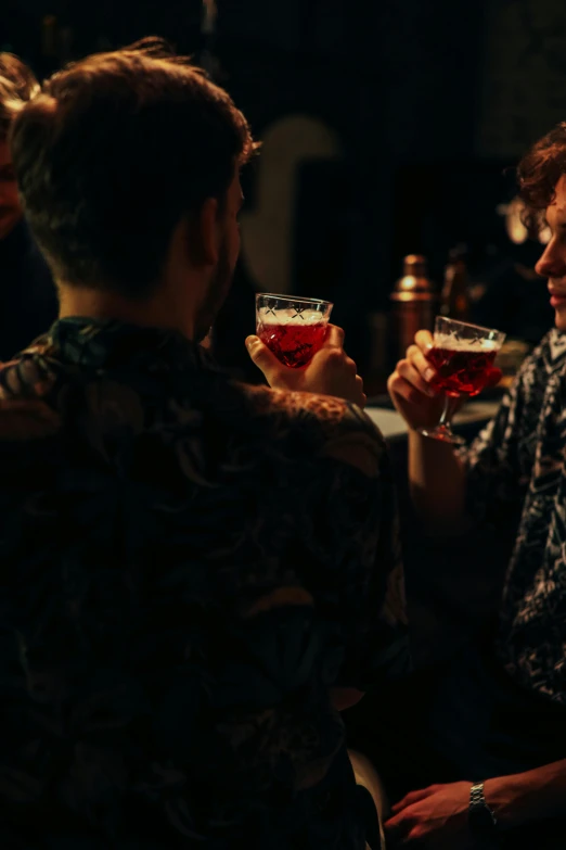 a man drinking alcohol from his wine glass