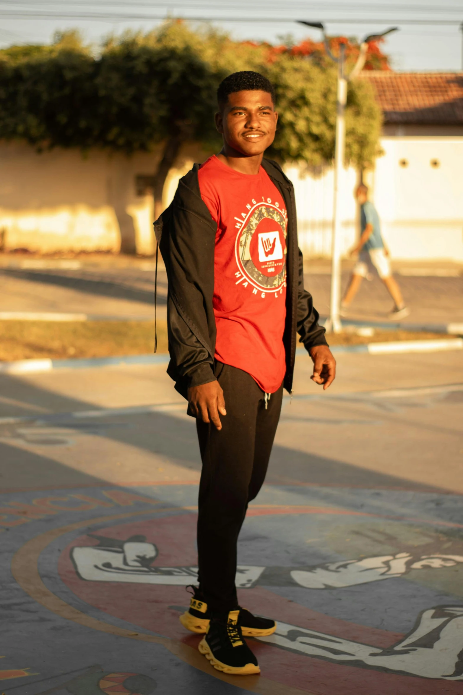 a young man is on his skateboard outside