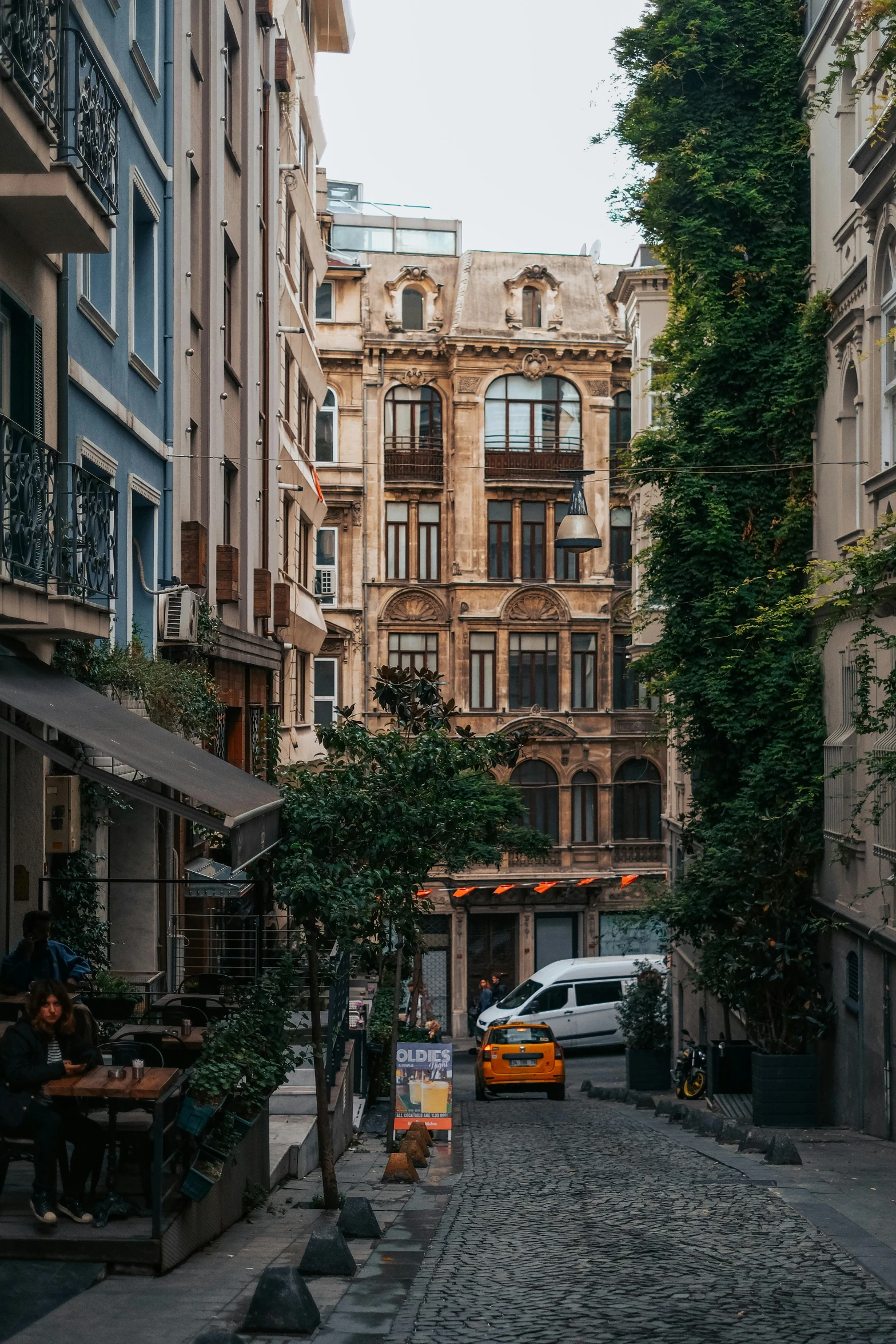 a large building in the middle of a cobblestone area