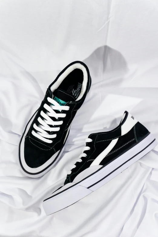 an unkempt black and white vans shoe