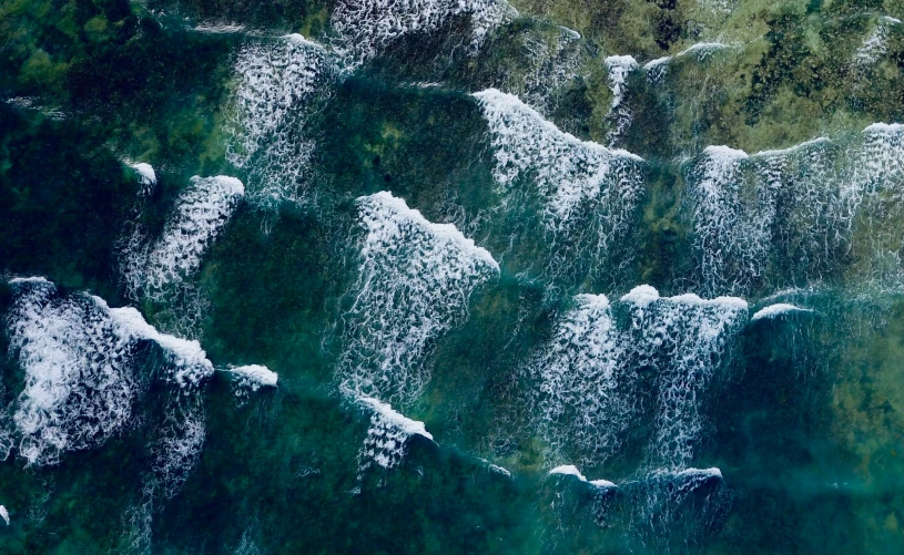 water flowing over a large waterfall at night