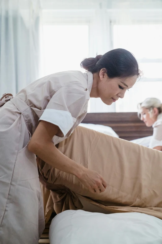 a person on a bed with some pillows