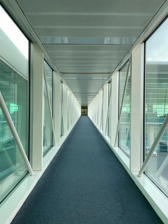 a long corridor lined with large glass doors