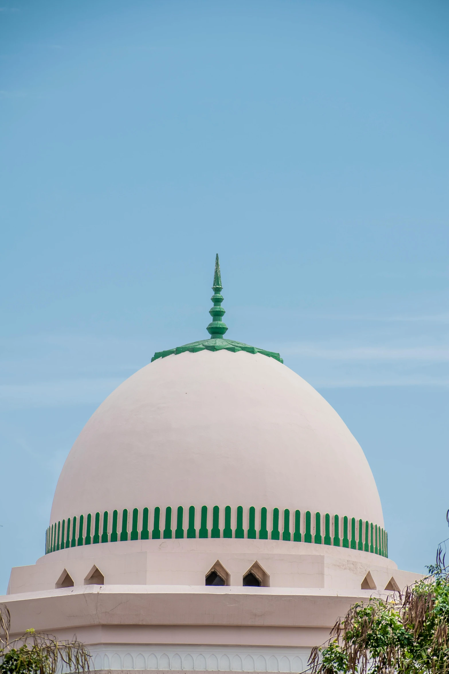 an ornately designed, domed building with a green top