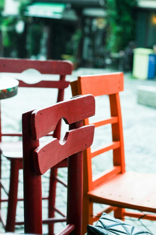 two chairs next to each other and one red one