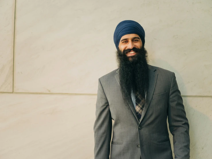 a man with a beard wearing a turban