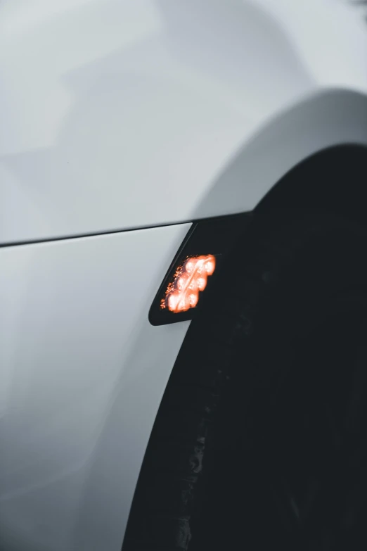 the side of a car with lights on