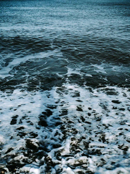 a frozen lake and ocean shore is shown