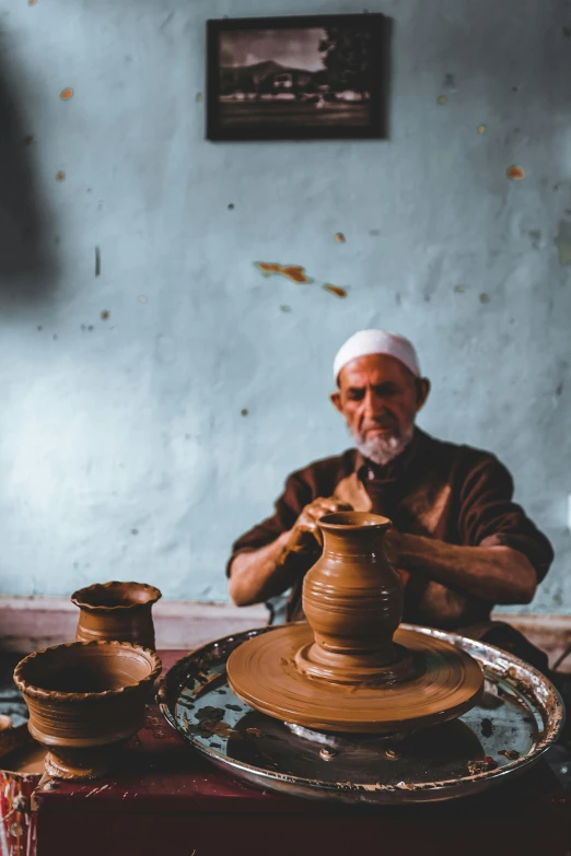 a person is making a piece of pottery