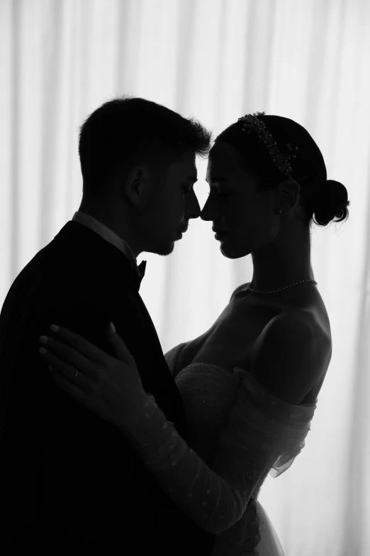 a man and woman in black and white posing for a picture