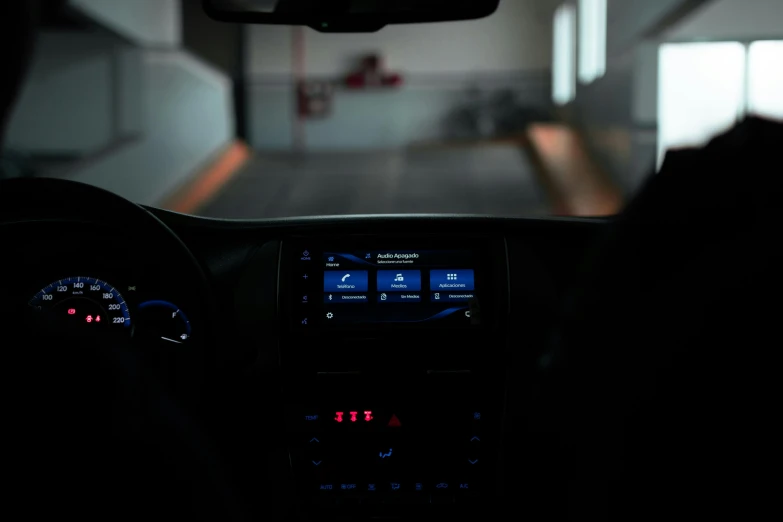 a driver's view of a dimly lit car