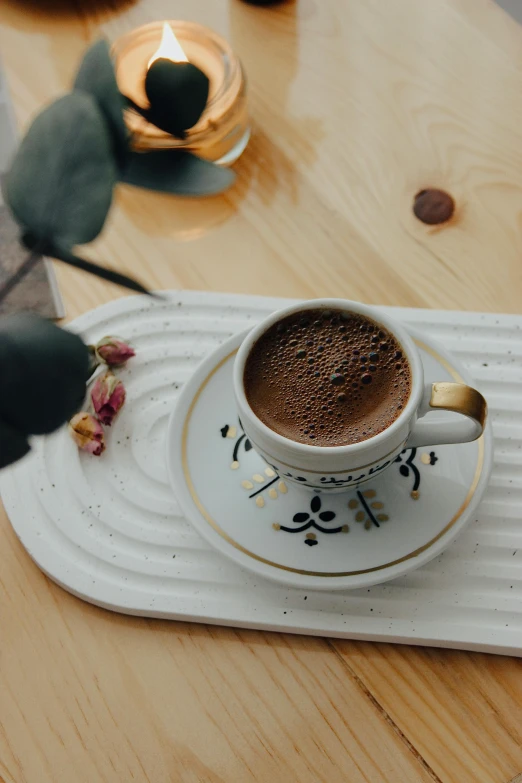 a cup of coffee sitting on top of a saucer