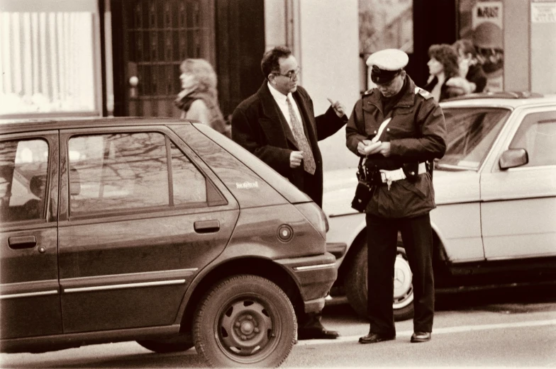 a black and white po of a person and some cars