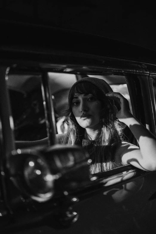 an image of two girls in the back seat of a car