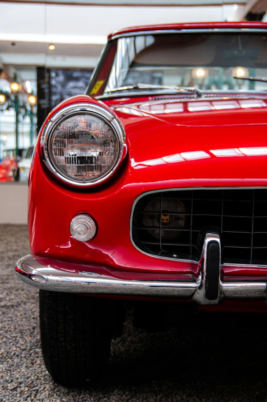 the front view of an old red car