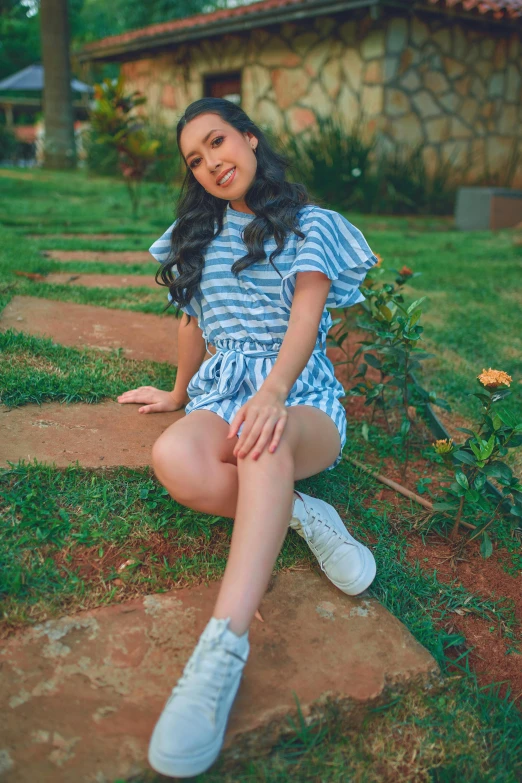 girl with long hair sitting on the ground