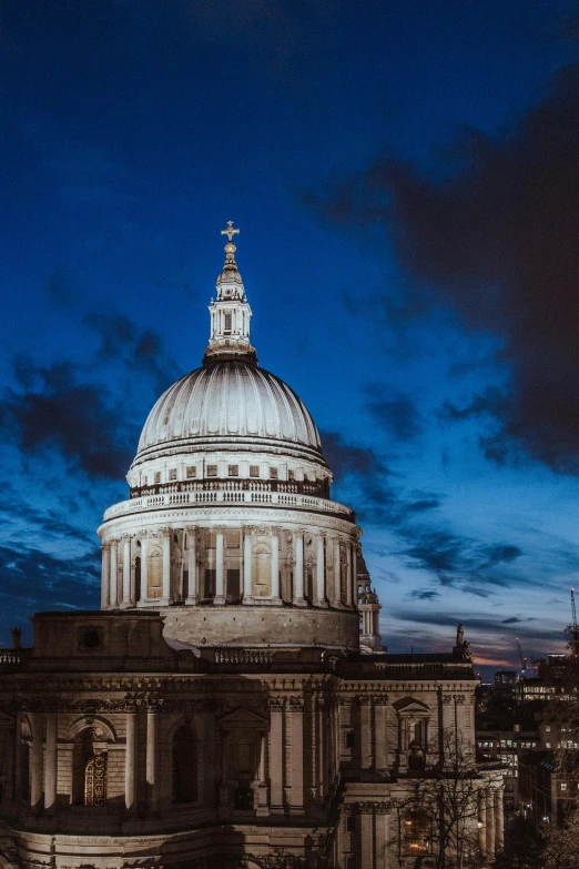 a dome with a clock on top of a building