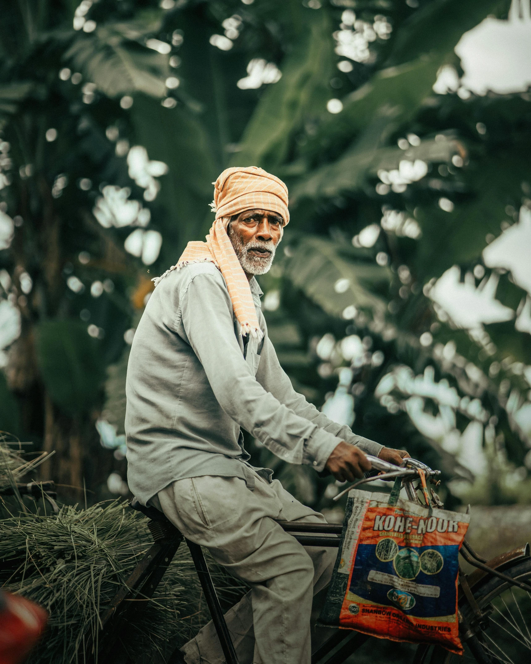 a person on top of a bicycle with bags of stuff